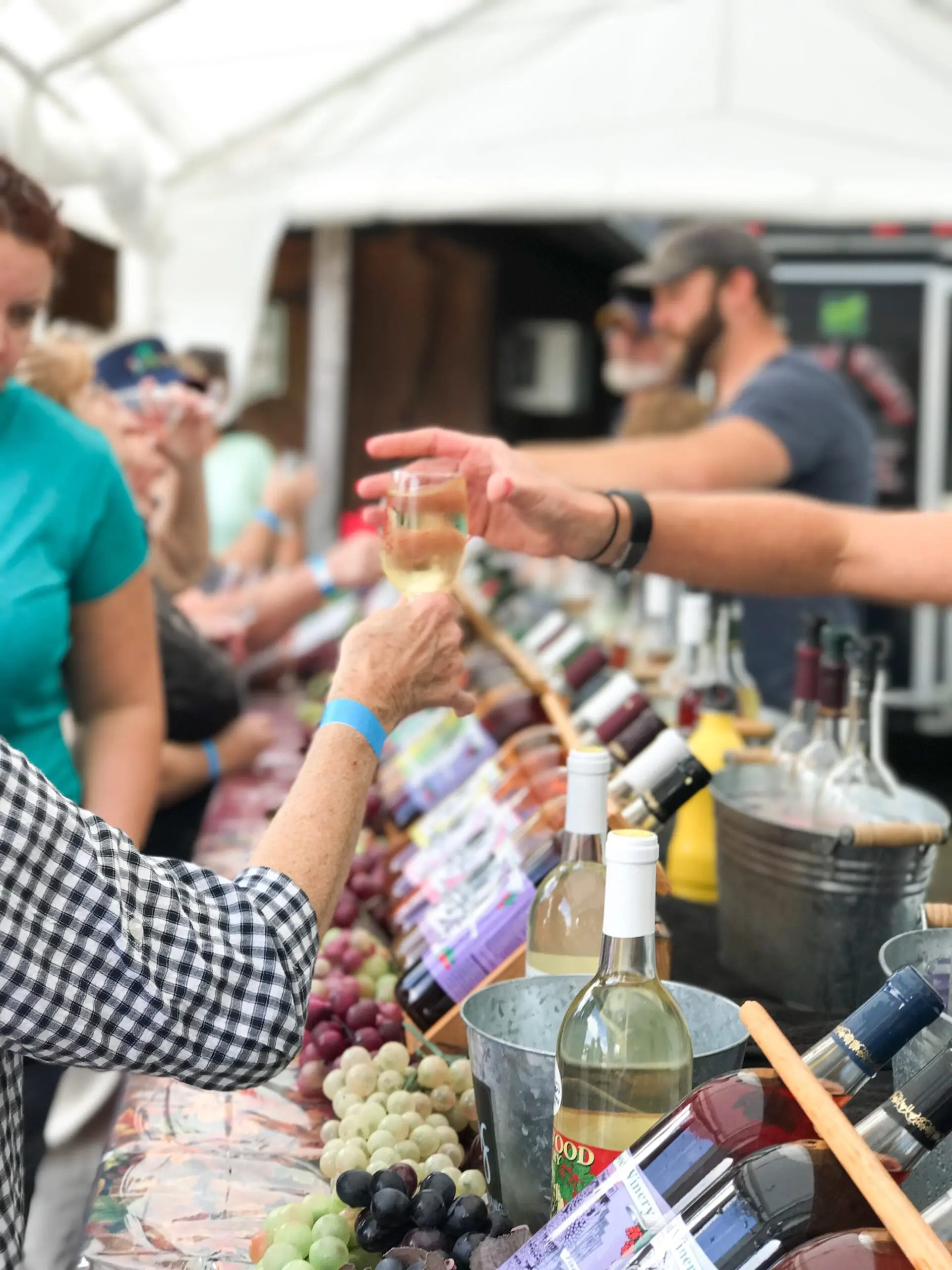 handing a glass of wine