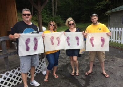 People with grape-stomp prints